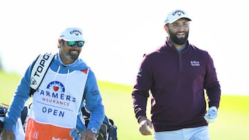 SAN DIEGO, CA - JANUARY 25: Jon Rahm and his caddie Adam Hayes looks on after his shot on the 4th hole on the South Course during the first round of the Farmers Insurance Open golf tournament on January 25, 2023, at Torrey Pines Municipal Golf Course in San Diego, CA. (Photo by Brian Rothmuller/Icon Sportswire via Getty Images)