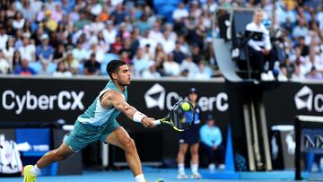 Spain's Carlos Alcaraz hits a return against Kazakhstan's Alexander Shevchenko during their men's singles match on day two of the Australian Open tennis tournament in Melbourne on January 13, 2025. (Photo by Martin KEEP / AFP) / -- IMAGE RESTRICTED TO EDITORIAL USE - STRICTLY NO COMMERCIAL USE --