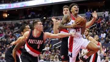 Jan 16, 2017; Washington, DC, USA; Washington Wizards forward Kelly Oubre Jr. (12) is fouled while shooting the ball by Portland Trail Blazers guard Pat Connaughton (5) in the fourth quarter at Verizon Center. The Wizards won 120-101. Mandatory Credit: Geoff Burke-USA TODAY Sports