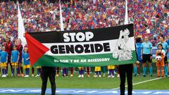 Soccer Football - Women's Champions League - Final - FC Barcelona v Olympique Lyonnais - San Mames, Bilbao, Spain - May 25, 2024 A Palestine flag is displayed before the match with a message reading "stop genozide EU don't be an accessory" amid the ongoing conflict between Israel and Hamas REUTERS/Vincent West