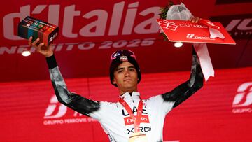 UAE Team Emirates XRG's Mexican rider Isaac Del Toro, current overall leader, celebrates on the podium after winning the 17th stage of the 108th Giro d'Italia cycling race, 155kms from San Michele all'Adige to Bormio, on May 28, 2025. (Photo by Luca Bettini / AFP)