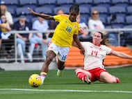 Mar 1, 2026; Nashville, Tennessee, USA; Canada defender Vanessa Gilles (14) tackles Columbia midfielder Linda Caicedo (18) during the second half at GEODIS Park. Mandatory Credit: Steve Roberts-Imagn Images