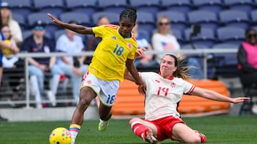 Mar 1, 2026; Nashville, Tennessee, USA; Canada defender Vanessa Gilles (14) tackles Columbia midfielder Linda Caicedo (18) during the second half at GEODIS Park. Mandatory Credit: Steve Roberts-Imagn Images