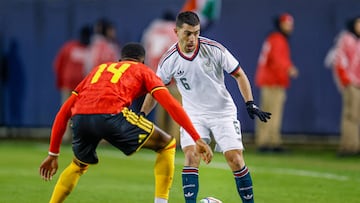 Mexico's midfielder #06 Erik Lira is challenged by Belgium's forward #14 Dodi Lukebakio during a friendly football match between Mexico and Belgium at Soldier Field in Chicago, Illinois, on March 31, 2026. (Photo by KAMIL KRZACZYNSKI / AFP)