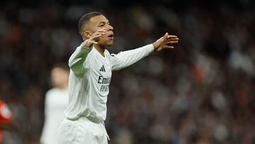 Real Madrid's French forward #09 Kylian Mbappe reacts during the Spanish league football match between Real Madrid CF and Sevilla FC at the Santiago Bernabeu stadium in Madrid on December 22, 2024. (Photo by OSCAR DEL POZO / AFP)
