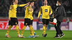 STUTTGART, GERMANY - APRIL 08: Erling Haaland consoles Giovanni Reyna of Dortmund who walks off the picth very soon after the start during the Bundesliga match between VfB Stuttgart and Borussia Dortmund at Mercedes-Benz Arena on April 08, 2022 in Stuttgart, Germany. (Photo by Matthias Hangst/Getty Images)