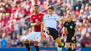 Manchester United's Brazilian midfielder #18 Casemiro (L) and Rosenborg's Norwegian midfielder #41 midfielder Sverre Nypan vie for the ball during the friendly football match between Rosenborg BK and Manchester United at the Lerkendal Stadium in Trondheim, Norway on July 15, 2024. (Photo by Ole Martin Wold / NTB / AFP) / Norway OUT