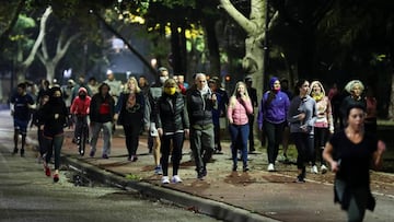 People jog at a park, as the city of Buenos Aires eases their lockdown restrictions, during the spread of the coronavirus disease (COVID-19), in Buenos Aires, Argentina June 8, 2020. REUTERS/Agustin Marcarian