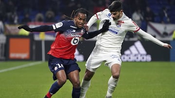 Lille's Renato Luz Sanches, left, challenges with Lyon's Martin Terrier, during the French League One soccer match between Lyon and Lille in Decines, near Lyon, central France, Tuesday, Dec. 3, 2019. (AP Photo/Laurent Cipriani)