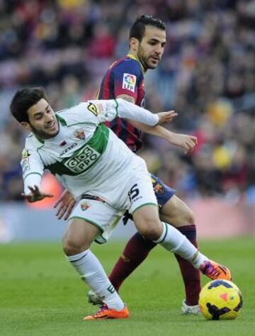 Carles Gil con Cesc Fàbregas.