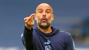 (FILES) In this file photo taken on July 15, 2020 Manchester City&#039;s Spanish manager Pep Guardiola gestures from the sidelines during the English Premier League football match between Manchester City and Bournemouth at the Etihad Stadium in Manchester