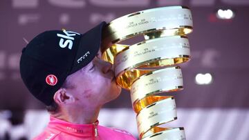 Pink jersey Britain's rider of team Sky Christopher Froome, winner, kisses the trophy on the podium after the 21st and last stage of the 101st Giro d'Italia, Tour of Italy cycling race, on May 27, 2018 in Rome.
Britain's Chris Froome comp
