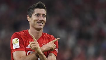 Bayern Munich&#039;s Robert Lewandowski celebrates after scoring the opening goal during the German Bundesliga soccer match between Bayern Munich and Hertha BSC Berlin in Munich on Friday, Aug. 16, 2019. (Matthias Balk/dpa via AP)