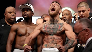 LAS VEGAS, NV - AUGUST 25: UFC lightweight champion Conor McGregor (R) screams after the face off with Floyd Mayweather Jr. during their official weigh-in at T-Mobile Arena on August 25, 2017 in Las Vegas, Nevada. The two will meet in a super welterweight boxing match at T-Mobile Arena on August 26.   Christian Petersen/Getty Images/AFP
 == FOR NEWSPAPERS, INTERNET, TELCOS &amp; TELEVISION USE ONLY ==