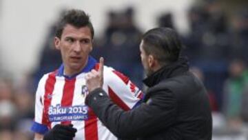 Mandzukic, con Simeone.