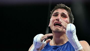 Mexico's Marco Alonso Verde Alvarez celebrates his victory over India's Nishant Dev in the men's 57kg quarter-final boxing match during the Paris 2024 Olympic Games at the North Paris Arena, in Villepinte on August 3, 2024. (Photo by MOHD RASFAN / AFP)