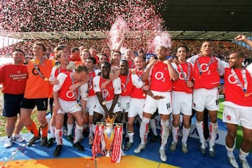 Arsenal's 'Invincibles' celebrate winning the Premier League title in 2004, having remained unbeaten throughout the entire top-flight season.
