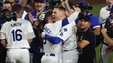 LOS ANGELES, CALIFORNIA - OCTOBER 25: Enrique Hernandez #8 and Freddie Freeman #5 of the Los Angeles Dodgers celebrate Freeman's walk-off grand slam to win Game One of the 2024 World Series against the New York Yankees at Dodger Stadium on October 25, 2024 in Los Angeles, California. Steph Chambers/Getty Images/AFP (Photo by Steph Chambers / GETTY IMAGES NORTH AMERICA / Getty Images via AFP)