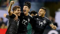 CHICAGO, ILLINOIS - JULY 07: Jonathan dos Santos #6, Uriel Antuna #22, and Alexis Vega #14 of the Mexico celebrate after beating the United States 1-0 in the 2019 CONCACAF Gold Cup Final at Soldier Field on July 07, 2019 in Chicago, Illinois.   Dylan Buell/Getty Images/AFP
 == FOR NEWSPAPERS, INTERNET, TELCOS &amp; TELEVISION USE ONLY ==