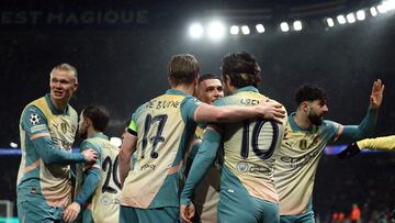 Manchester City's English midfielder #10 Jack Grealish (2ndR) is congratulated by teammates after scoring a goal during the UEFA Champions League, league phase football match between Paris Saint-Germain and Manchester City at the Parc des Princes Stadium in Paris on January 22, 2025. (Photo by Franck FIFE / AFP)