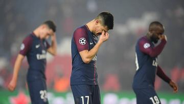 PARIS, FRANCE - MARCH 06: Yuri Berchiche of PSG (17) and team mates look dejected in defeat after the UEFA Champions League Round of 16 Second Leg match between Paris Saint-Germain and Real Madrid at Parc des Princes on March 6, 2018 in Paris, France. (