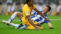 Barcelona's French defender #23 Jules Kounde and FC Porto's Brazilian forward #11 Pepe fall during the UEFA Champions League 1st round day 2 group H football match between FC Porto and FC Barcelona at the Dragao stadium in Porto on October 4, 2023. (Photo by Patricia DE MELO MOREIRA / AFP)