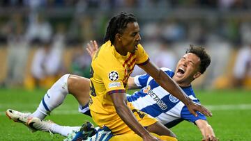 Barcelona's French defender #23 Jules Kounde and FC Porto's Brazilian forward #11 Pepe fall during the UEFA Champions League 1st round day 2 group H football match between FC Porto and FC Barcelona at the Dragao stadium in Porto on October 4, 2023. (Photo by Patricia DE MELO MOREIRA / AFP)