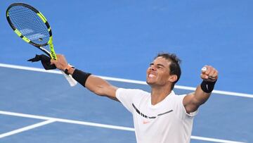 Spain's Rafael Nadal celebrates his victory against Russia's Alexander Zverev during their men's singles third round match on day six of the Australian Open tennis tournament in Melbourne on January 21, 2017. / AFP PHOTO / SAEED KHAN / IMAGE RESTRICTED TO EDITORIAL USE - STRICTLY NO COMMERCIAL USE