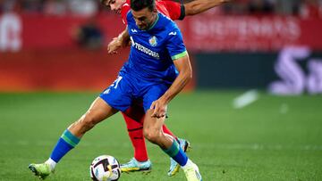 GIRONA, SPAIN - AUGUST 22: Miguel Gutierrez of Girona FC competes for the ball with Juan Iglesias of Getafe CF during the LaLiga Santander match between Girona FC and Getafe CF at Montilivi Stadium on August 22, 2022 in Girona, Spain. (Photo by Sergio Carmona/Quality Sport Images/Getty Images)