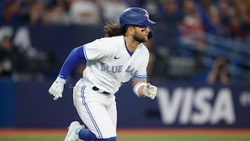 TORONTO, ON - APRIL 14: Bo Bichette #11 of the Toronto Blue Jays runs out a single in the fifth inning of their MLB game at against the Tampa Bay Rays Rogers Centre on April 14, 2023 in Toronto, Canada.   Cole Burston/Getty Images/AFP (Photo by Cole Burston / GETTY IMAGES NORTH AMERICA / Getty Images via AFP)