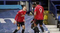 LIVERPOOL, ENGLAND - DECEMBER 23: Edinson Cavani (l) of Manchester United celebrates with team mates Axel Tuanzebe and Anthony Martial (r) after scoring their sides first goal during the Carabao Cup Quarter Final match between Everton and Manchester Unite