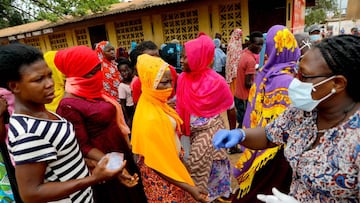 FILE PHOTO: People wait to receive goods from volunteers during food and water distribution to the underprivileged and homeless, as Ghana enforces a partial lockdown in Accra and Kumasi in efforts to slow the spread of the coronavirus disease (COVID-19), 