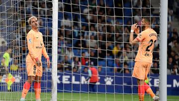 Atletico Madrid's French forward Antoine Griezmann (L) and Atletico Madrid's Belgian midfielder Yannick Ferreira-Carrasco react during the Spanish league football match between RCD Espanyol and Club Atletico de Madrid at the RCDE Stadium in Cornella de Llobregat on May 24, 2023. (Photo by Josep LAGO / AFP)