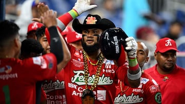 Panama's pitcher #30 Carlos Daniel Rodriguez celebrates after hitting a home run during the Caribbean Series baseball game between Panama and Venezuela at Marlins Park in Miami, Florida, on February 6, 2024. (Photo by Chandan Khanna / AFP)