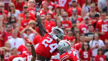 Sep 3, 2016; Columbus, OH, USA; Ohio State Buckeyes safety Malik Hooker (24) intercepts the pass in front of Bowling Green Falcons wide receiver Ronnie Moore (5) during the first half at Ohio Stadium. The Buckeyes lead 35-10. Mandatory Credit: Joe Maiorana-USA TODAY Sports