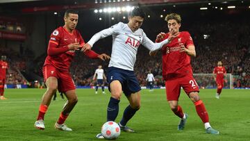 Tottenham Hotspur's South Korean striker Son Heung-Min (C) vies with Liverpool's Spanish midfielder Thiago Alcantara (L) and Liverpool's Greek defender Kostas Tsimikas (R) during the English Premier League football match between Liverpool a