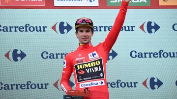 Team Jumbo rider Slovenia's Primoz Roglic celebrates on the podium with the leader's red jersey after the 19th stage of the 2019 La Vuelta cycling Tour of Spain, a 165,2 km race from Avila to Toledo on September 13, 2019. (Photo by OSCAR DEL POZO / AFP)