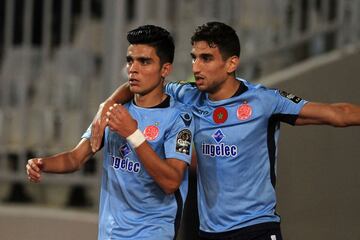 Wydad's striker Achraf Bencharki (L) celebrates his equalising goal with his teammate during the CAF Champions League final football match between Al-Ahly vs Wydad Casablanca at the Borg El Arab Stadium in Alexandria on October 28, 2017