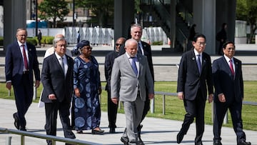 HIROSHIMA, JAPAN - MAY 21:  Vietnam's Prime Minister Pham Minh Chinh, Japan's Prime Minister Fumio Kishida, Organization for Economic Co-operation and Development (OECD) Secretary-General Mathias Cormann, Brazil's President Luiz Inacio Lula da Silva, Comoros' President Azali Assoumani, India's Prime Minister Narendra Modi (obscured), United Nations Secretary General Antonio Guterres and Australia's Prime Minister Anthony Albanese walk out from the Peace Memorial Museum to a wreath-laying ceremony in the Peace Memorial Park at the G7 summit on May 21, 2023 in Hiroshima, Japan.    Takashi Aoyama/Pool via REUTERS