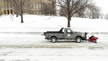 A car plows snow next to Iowa State Capitol, ahead of Iowa state caucus vote, in Des Moines, Iowa, U.S. January 15, 2024. REUTERS/Marco Bello