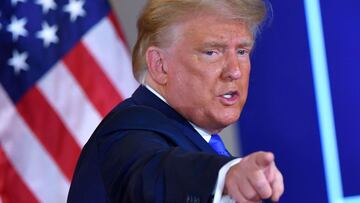 (FILES) In this file photo taken on November 04, 2020 US President Donald Trump gestures after speaking during election night in the East Room of the White House in Washington, DC. - US President Donald Trump has confirmed he will address a rally of his s