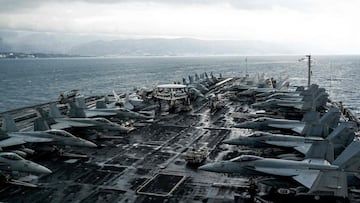 Fighter jet aircrafts are stationed on the deck of the nuclear-powered aircraft carrier USS Harry S. Truman.