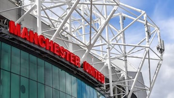 A sign on the Old Trafford football ground, home of Manchester United Football Club in Manchester, UK, on Friday, Aug. 19, 2022. Manchester United FCs owners are considering opening up the iconic English football club to a new investor -- with private equity firms likely to be crowding the field alongside high-net worth individuals. Photographer: Anthony Devlin/Bloomberg via Getty Images