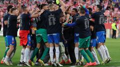 Girona players celebrate their qualification for the UEFA Champions League after winning the Spanish league football match between Girona FC and FC Barcelona at the Montilivi stadium in Girona on May 4, 2024. (Photo by LLUIS GENE / AFP)