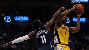 DALLAS, TEXAS - MARCH 08: T.J. Warren #1 of the Indiana Pacers takes a shot against Tim Hardaway Jr. #11 of the Dallas Mavericks at American Airlines Center on March 08, 2020 in Dallas, Texas. NOTE TO USER: User expressly acknowledges and agrees that, by downloading and or using this photograph, User is consenting to the terms and conditions of the Getty Images License Agreement. Ronald Martinez/Getty Images/AFP
== FOR NEWSPAPERS, INTERNET, TELCOS & TELEVISION USE ONLY ==