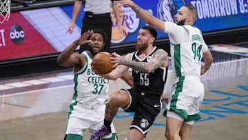 Brooklyn Nets forward Mike James (55) goes to the basket against Boston Celtics forward Semi Ojeleye (37) and guard Evan Fournier (94) during the second half of an NBA basketball game, Friday, April 23, 2021, in New York. (AP Photo/Mary Altaffer)