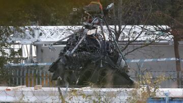 (FILES) In this file photo taken on November 01, 2018 Part of what remains of the helicopter that crashed outside Leicester City Football Club's King Power Stadium is lifted with a crane at the crash site in Leicester, eastern England, on November 1,