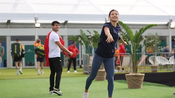 MALAGA, SPAIN - NOVEMBER 17: Carlos Alcaraz of Spain interacts as Emma Raducanu of Great Britain warms up during the Billie Jean King Cup Finals at Palacio de Deportes Jose Maria Martin Carpena on November 17, 2024 in Malaga, Spain. (Photo by Nathan Stirk/Getty Images for LTA)