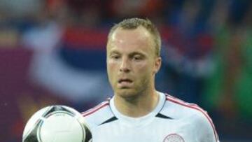 Danish defender Lars Jacobsen runs with the ball during the Euro 2012 football championships group match between the Netherlands and Denmark on June 9, 2012 at the Metalist Stadium in Kharkiv. AFP PHOTO / PATRICK HERTZOG