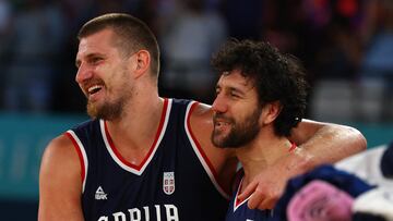 Paris 2024 Olympics - Basketball - Men's Bronze Medal Game - Germany vs Serbia - Bercy Arena, Paris, France - August 10, 2024. Bronze medallist Nikola Jokic of Serbia and Vasilije Micic of Serbia celebrate the team's win. REUTERS/Brian Snyder